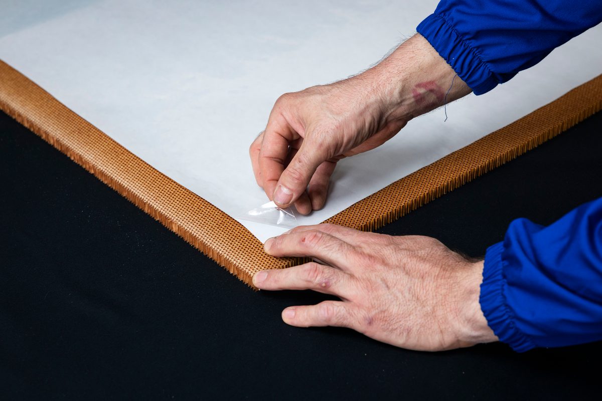 Applying MNL367AVC along the edge of a honeycomb panel